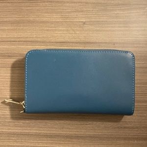 Dark blue wallet with one zipper and separate card compartment